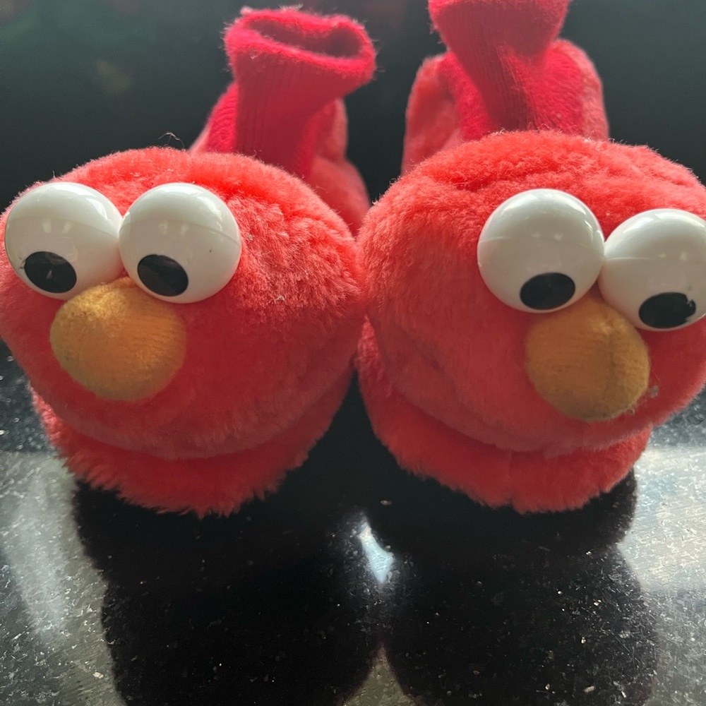 Elmo big kid slippers.  Toddler size large - 9/10.  Gently worn.